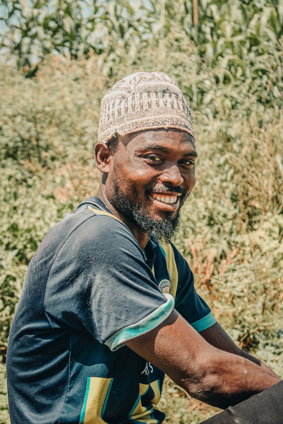 Marcus Reed smiling in a sunny field